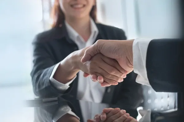 Professional team with hands stacked together