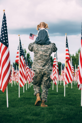 veteran with daughter on shoulders