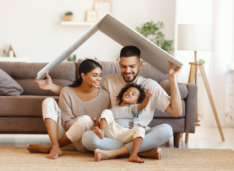 Happy family in living room under roof