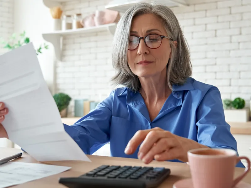 Older Lady Crunching Numbers