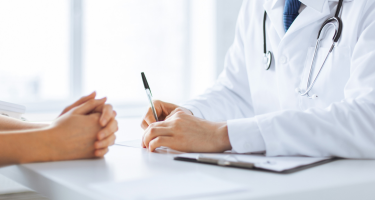 Doctor writing prescription
