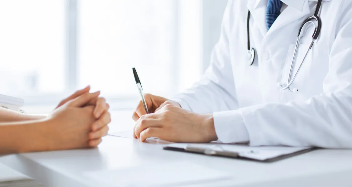 Doctor writing prescription