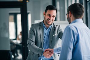 Two professional men shaking hands