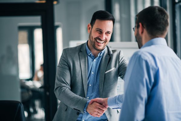 Two professional men shaking hands