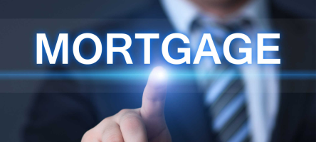 Business man pointing to mortgage