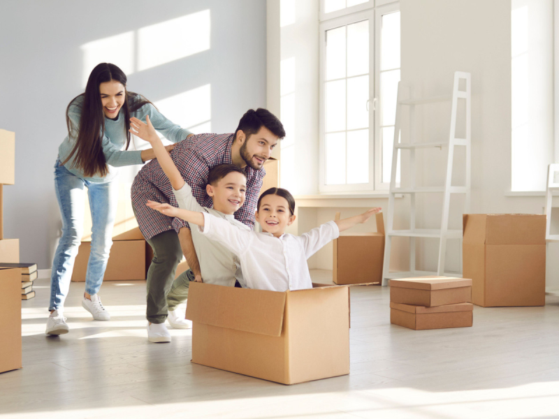 Happy family moving into new home
