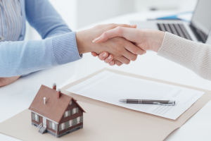 handshake with a house