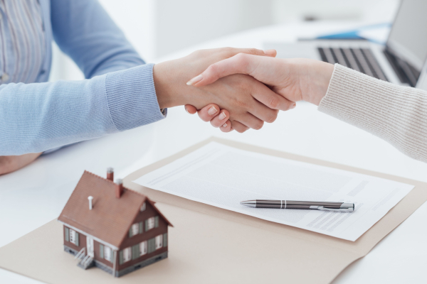 handshake with a house
