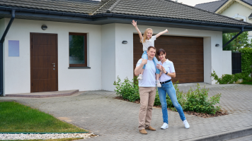 Happy Family in front of House