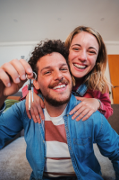 happy couple with keys to new home