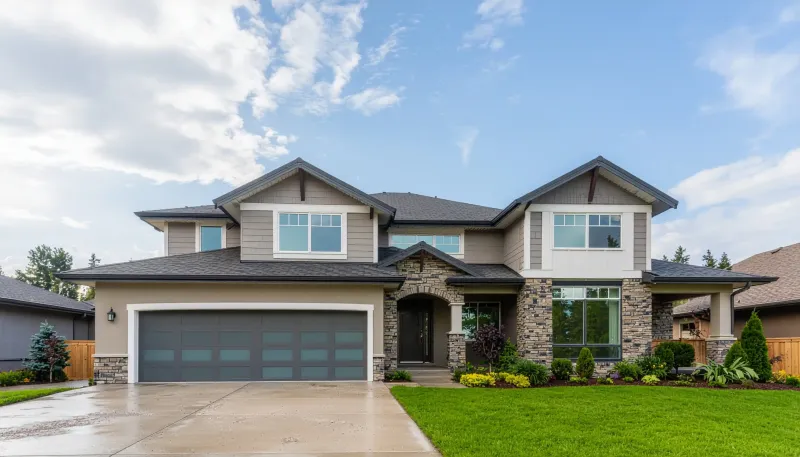 Family standing in front of a new home