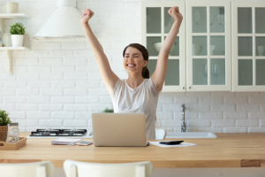 Young Woman with Arms Raised
