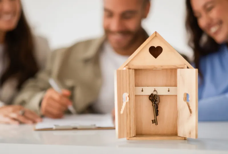 Couple signing mortgage paperwork