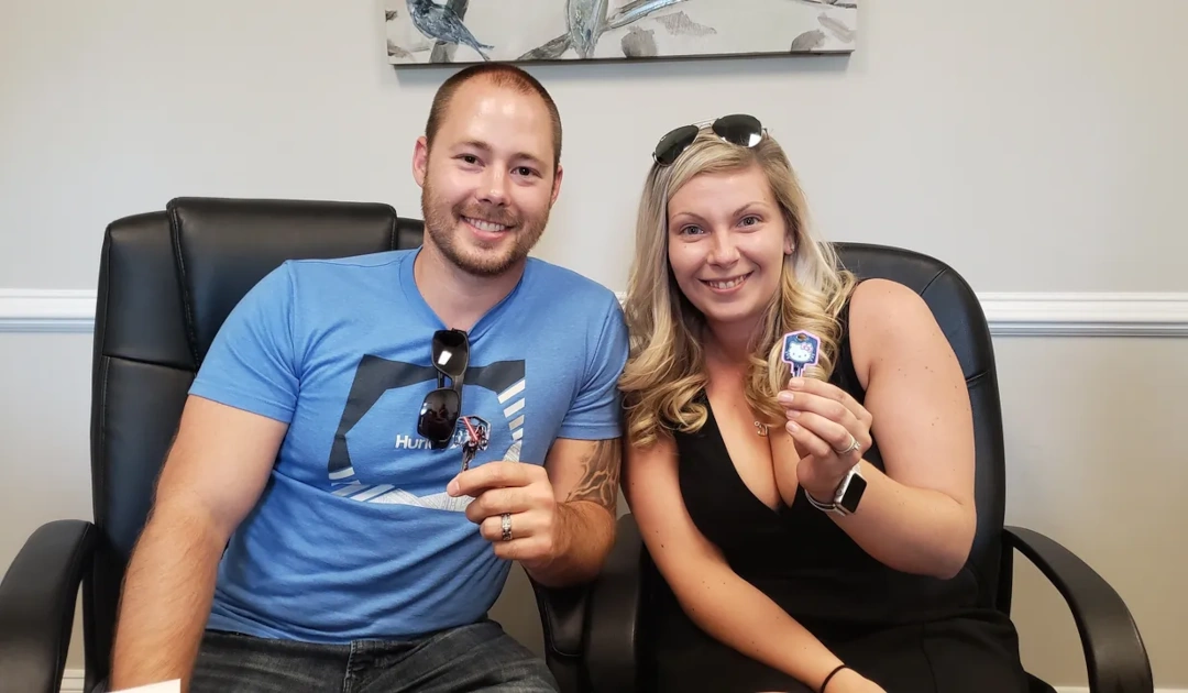 Happy Couple holding Key