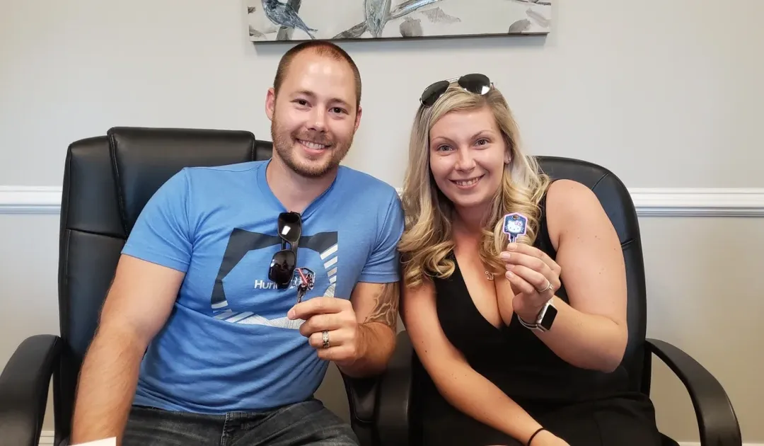 Happy Couple holding Key