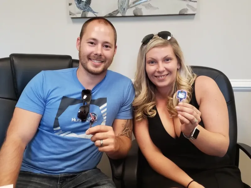 Happy Couple holding Key