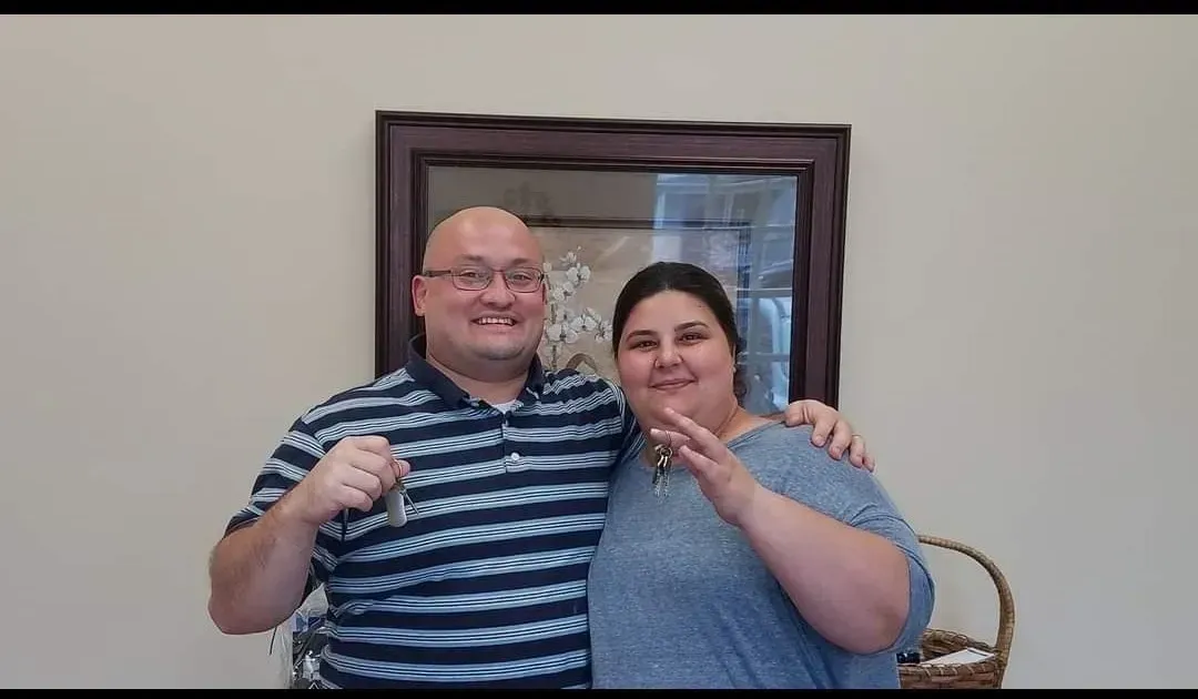 Happy Couple with Keys