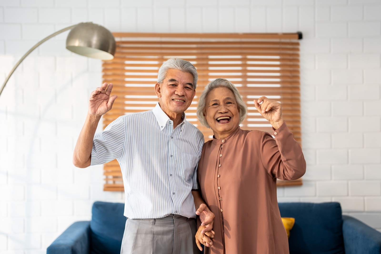 Happy couple in the home they get to keep