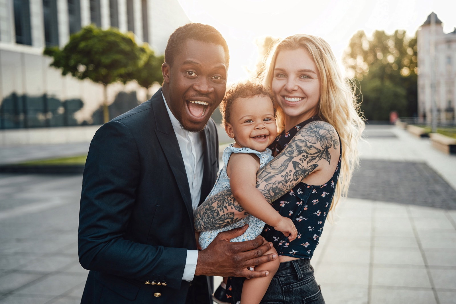 Happy mixed family of father, mother, and daughter