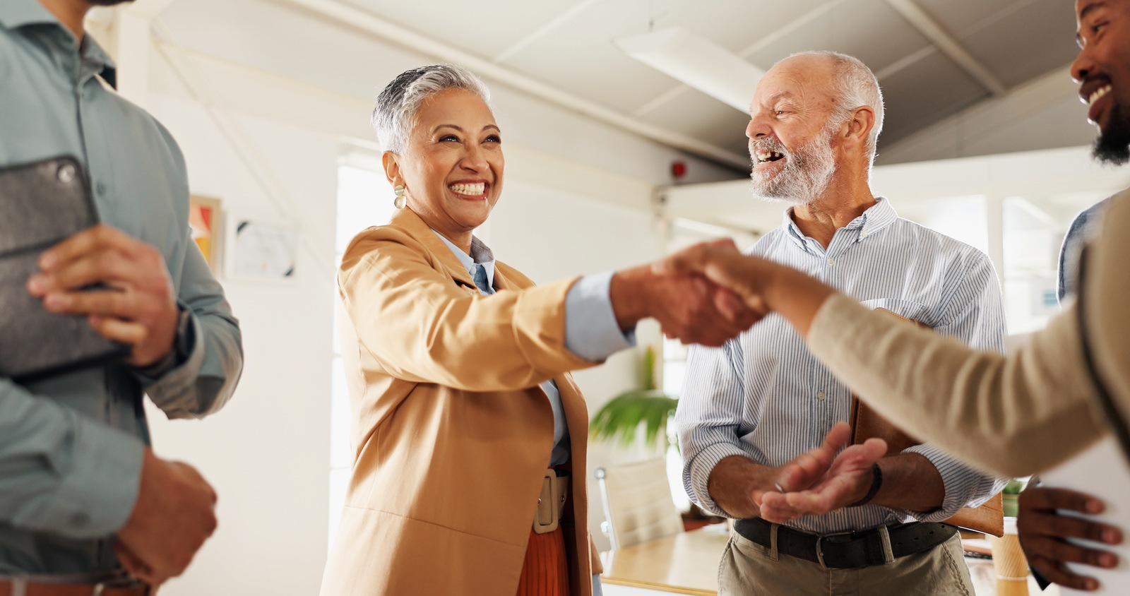 Business woman shaking hands with client after successful loan approval